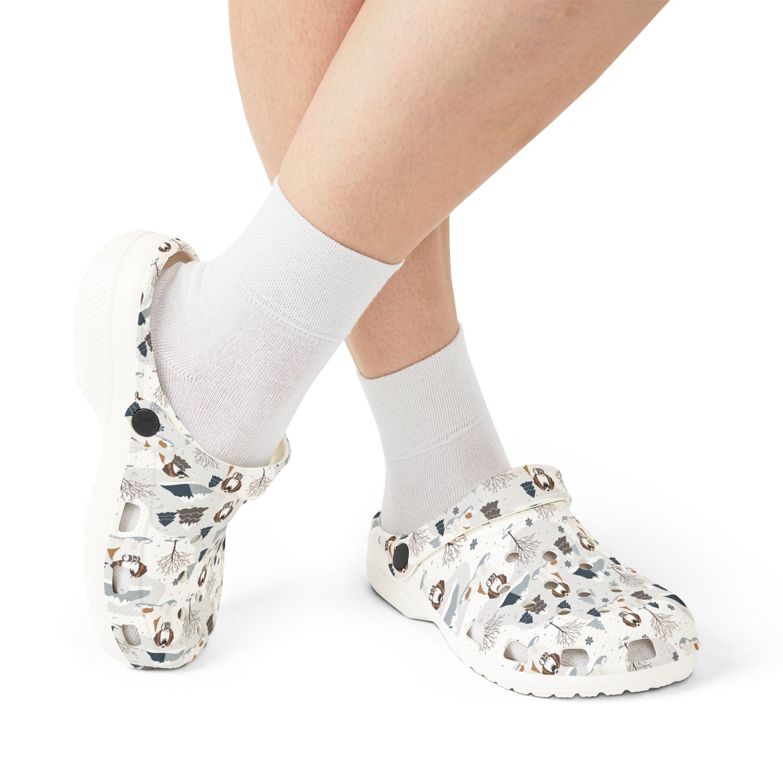 White EVA clog shoes with an all-over alpine mountain pattern featuring pines and Saint Bernards by Lucy and Norman