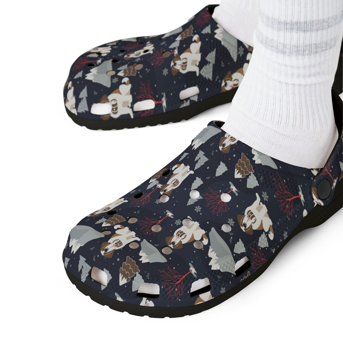 Black EVA clog slip on shoes with a navy all-over alpine night pattern featuring mountains, stars, pink trees and Saint Bernards by Lucy and Norman