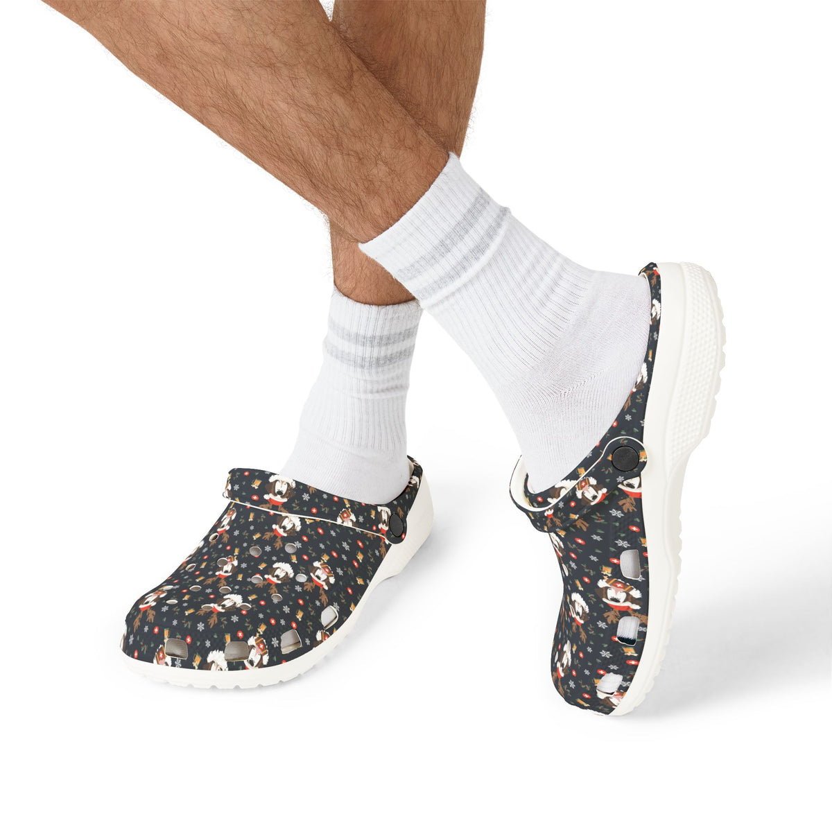 White rubber clog shoes with an all-over navy holiday print of Saint Bernards wearing reindeer antlers, beer barrels, and snowflakes by Lucy and Norman