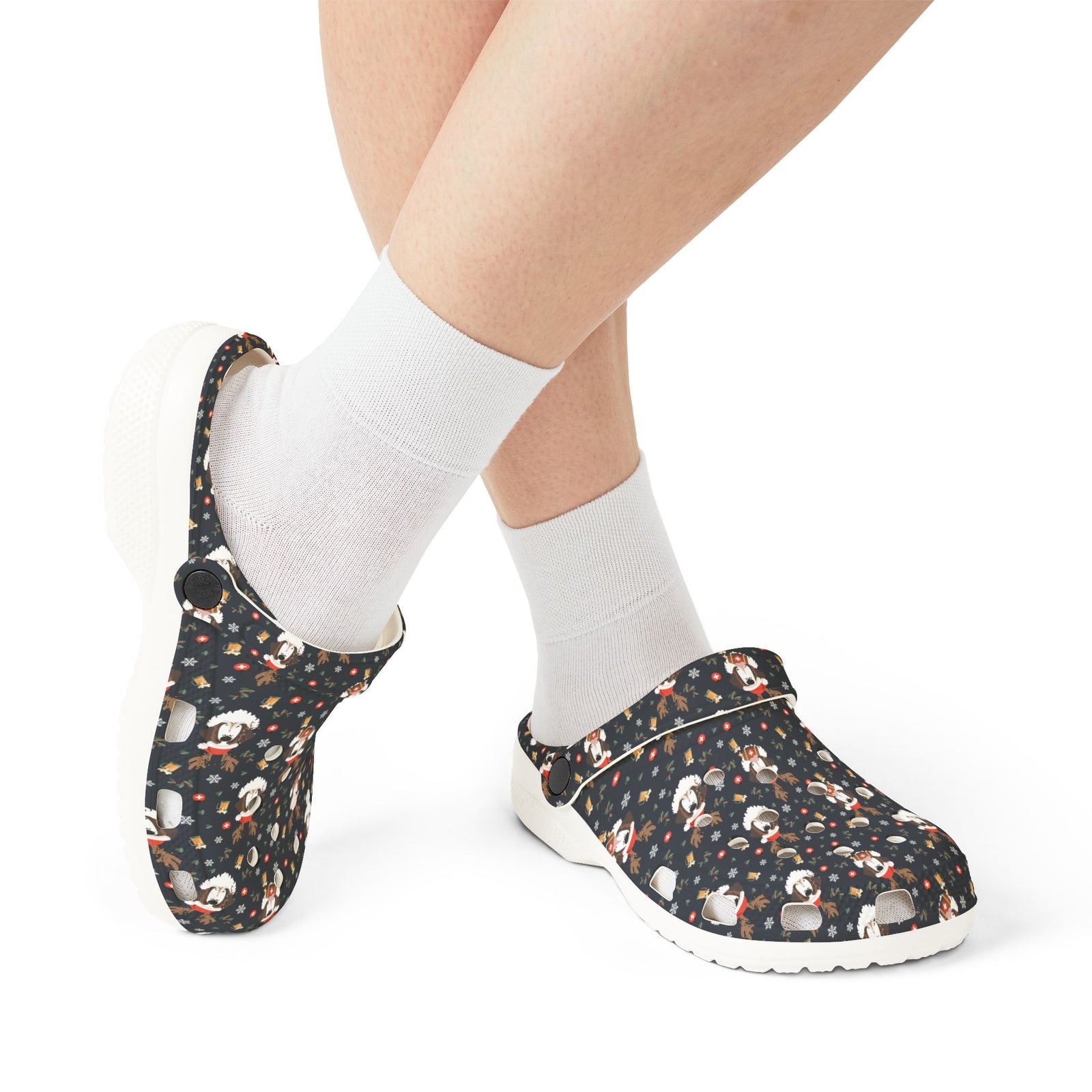 White rubber clog shoes with an all-over navy holiday print of Saint Bernards wearing reindeer antlers, beer barrels, and snowflakes by Lucy and Norman