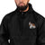 Black Champion packable windbreaker with chest embroidered Saint Bernard and barrel, half zip pullover with hood, kangaroo pocket, and zip pouch.