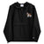 Black Champion packable windbreaker with chest embroidered Saint Bernard and barrel, half zip pullover with hood, kangaroo pocket, and zip pouch.