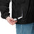 Lightweight, packable black windbreaker with chest embroidered Saint Bernard and barrel, adjustable hood, elastic cuffs, and zip pockets.