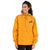 Gold Champion packable windbreaker with chest embroidered Saint Bernard and barrel, half zip pullover with hood, kangaroo pocket, and zip pouch.