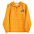 Gold Champion packable windbreaker with chest embroidered Saint Bernard and barrel, half zip pullover with hood, kangaroo pocket, and zip pouch.