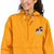 Gold Champion packable windbreaker with chest embroidered Saint Bernard and barrel, half zip pullover with hood, kangaroo pocket, and zip pouch.