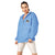 Light blue Champion packable windbreaker with chest embroidered Saint Bernard and barrel, half zip pullover with hood, kangaroo pocket, and zip pouch.