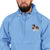 Light blue Champion packable windbreaker with chest embroidered Saint Bernard and barrel, half zip pullover with hood, kangaroo pocket, and zip pouch.