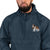 Navy blue Champion packable windbreaker with chest embroidered Saint Bernard and barrel, half zip pullover with hood, kangaroo pocket, and zip pouch.