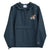 Navy blue Champion packable windbreaker with chest embroidered Saint Bernard and barrel, half zip pullover with hood, kangaroo pocket, and zip pouch.