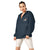 Navy blue Champion packable windbreaker with chest embroidered Saint Bernard and barrel, half zip pullover with hood, kangaroo pocket, and zip pouch.
