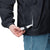 Lightweight, packable navy blue windbreaker with chest embroidered Saint Bernard and barrel, adjustable hood, elastic cuffs, and zip pockets.
