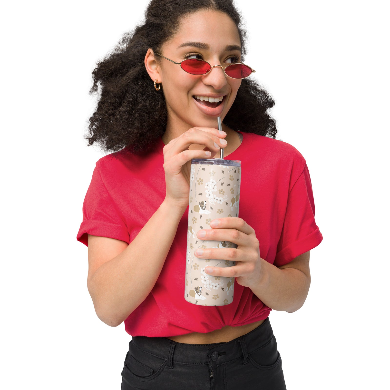 Stainless steel Forget Me Not Saint Bernard skinny tumbler with a blush finish featuring Saint Bernards among delicate white and golden florals, with a lid and metal straw.