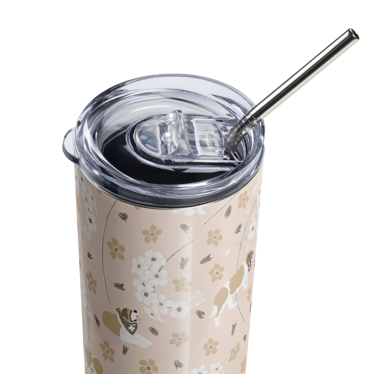 Stainless steel Forget Me Not Saint Bernard skinny tumbler with a blush finish featuring Saint Bernards among delicate white and golden florals, with a lid and metal straw.