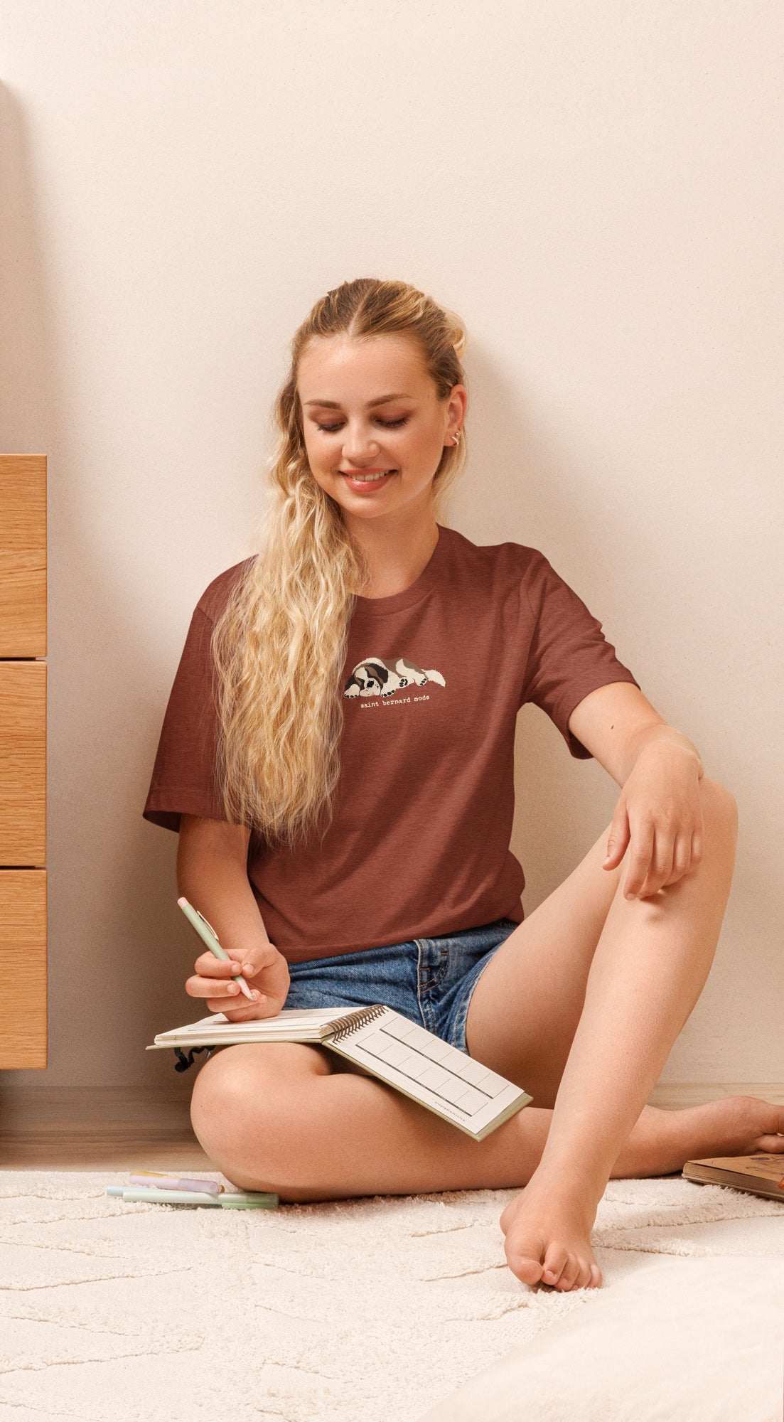 Lightweight t-shirt in clay with a sleeping Saint Bernard illustration and 'saint bernard mode' text" by Lucy + Norman.