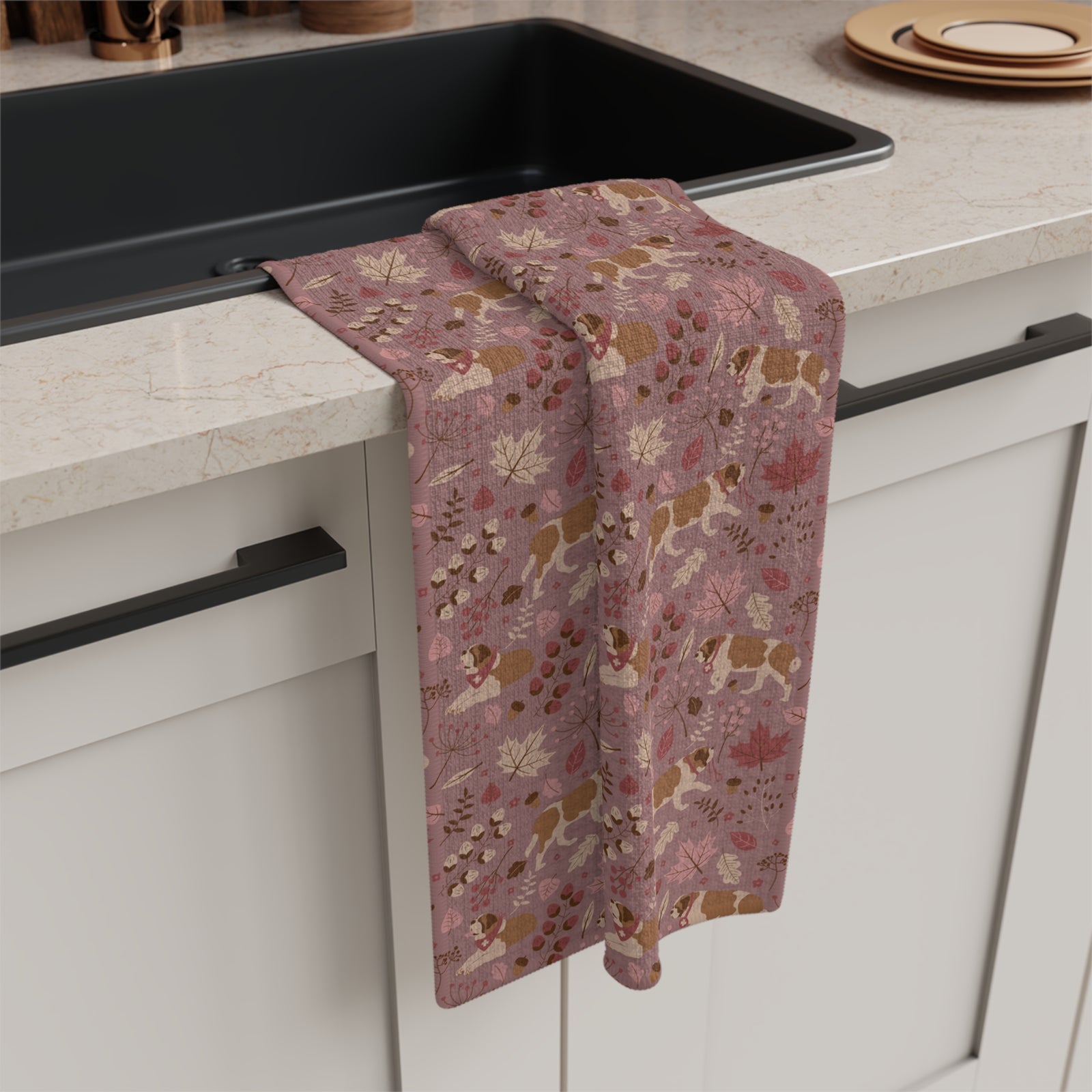 Rosy Fall Saint Bernard microfiber tea towel with a dusty-rose print of Saint Bernards among maple leaves, acorns, and autumn berries.