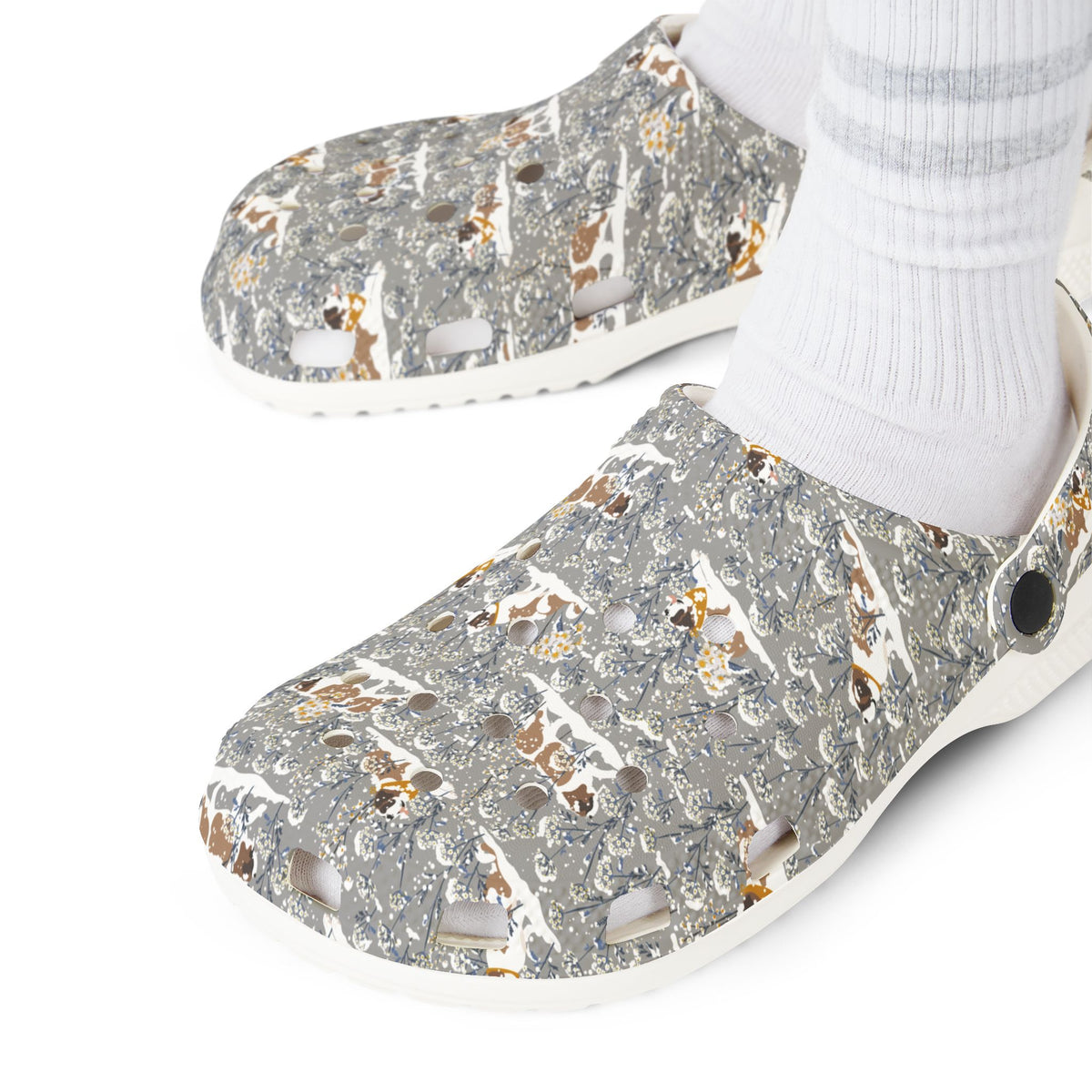 White EVA clog shoes with an all-over gray Saint Bernard pattern with snowy florals by Lucy and Norman