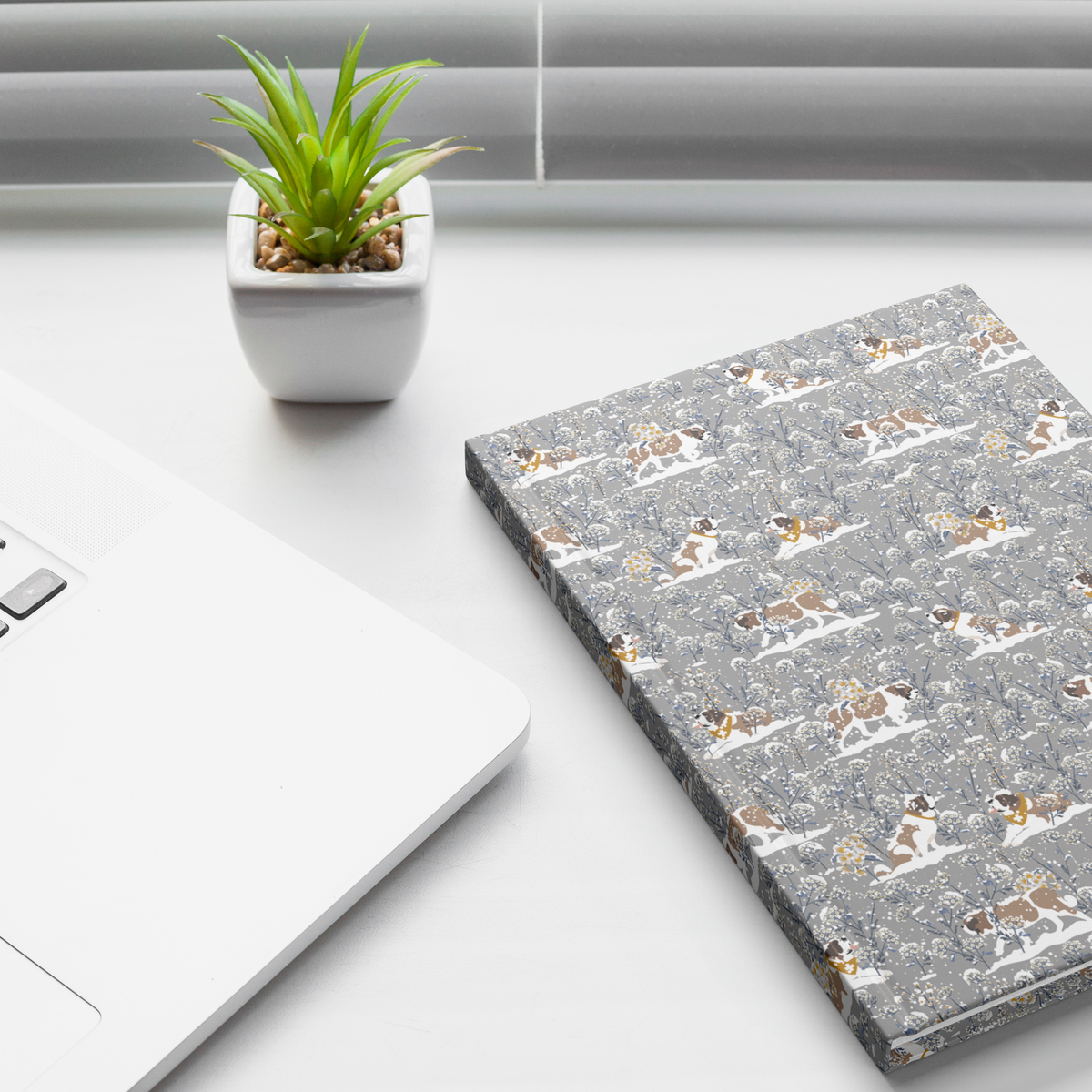 Snowflower Saint Bernard hardcover lined journal with a grey cover featuring Saint Bernards in golden bandanas among snowy winter wildflowers.