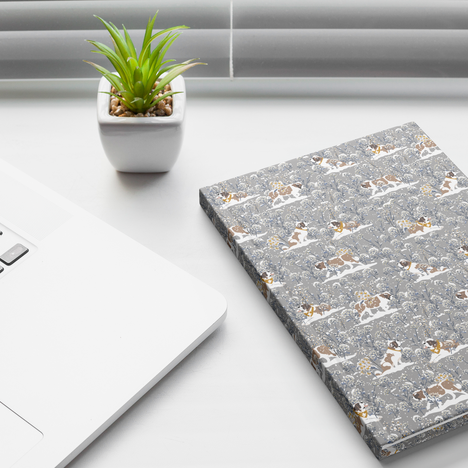 Snowflower Saint Bernard hardcover lined journal with a grey cover featuring Saint Bernards in golden bandanas among snowy winter wildflowers.