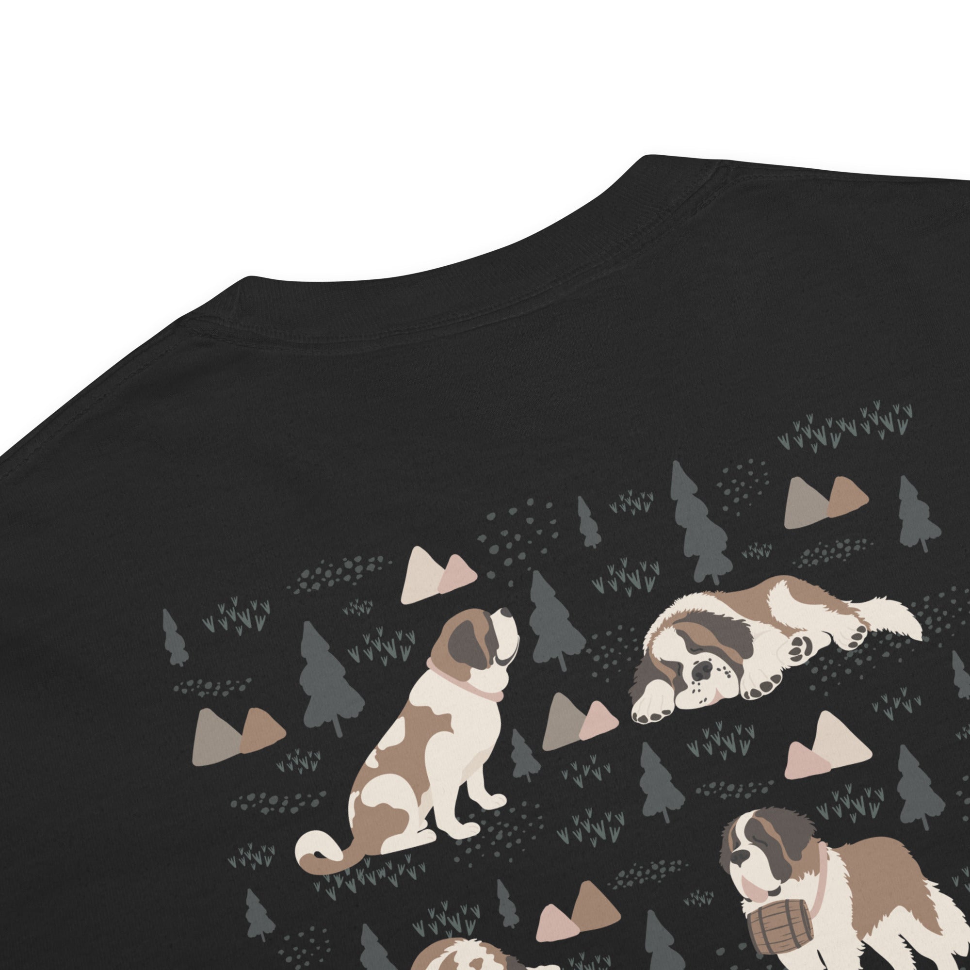 Comfort Colors black t-shirt featuring a woodland-mountain theme with Saint Bernard dogs on the back with a badge on left chest. Perfect Saint Bernard gift for dog lovers.
