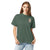 Comfort Colors blue spruce t-shirt featuring a woodland-mountain theme with Saint Bernard dogs on the back with a badge on left chest. Perfect Saint Bernard gift for dog lovers.