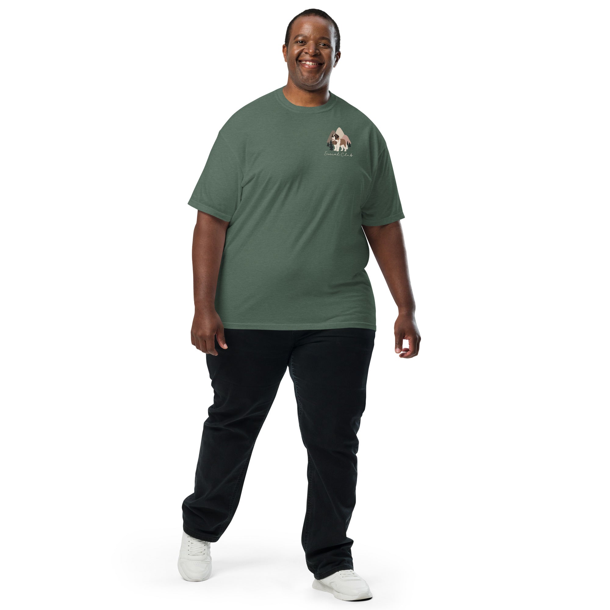 Comfort Colors blue spruce t-shirt featuring a woodland-mountain theme with Saint Bernard dogs on the back with a badge on left chest. Perfect Saint Bernard gift for dog lovers.