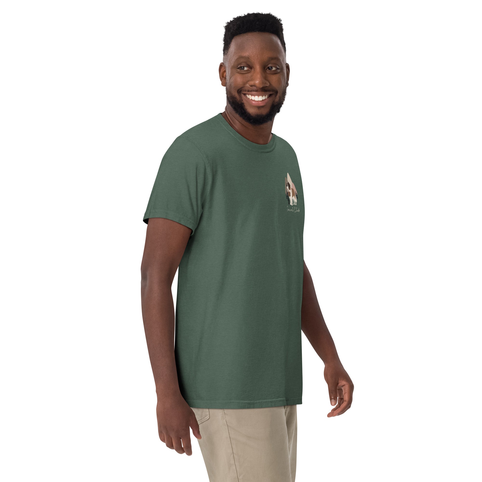 Comfort Colors blue spruce t-shirt featuring a woodland-mountain theme with Saint Bernard dogs on the back with a badge on left chest. Perfect Saint Bernard gift for dog lovers.