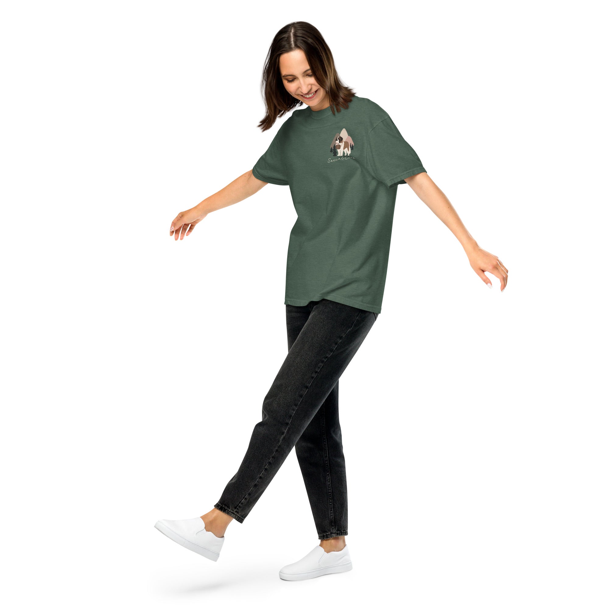 Comfort Colors blue spruce t-shirt featuring a woodland-mountain theme with Saint Bernard dogs on the back with a badge on left chest. Perfect Saint Bernard gift for dog lovers.