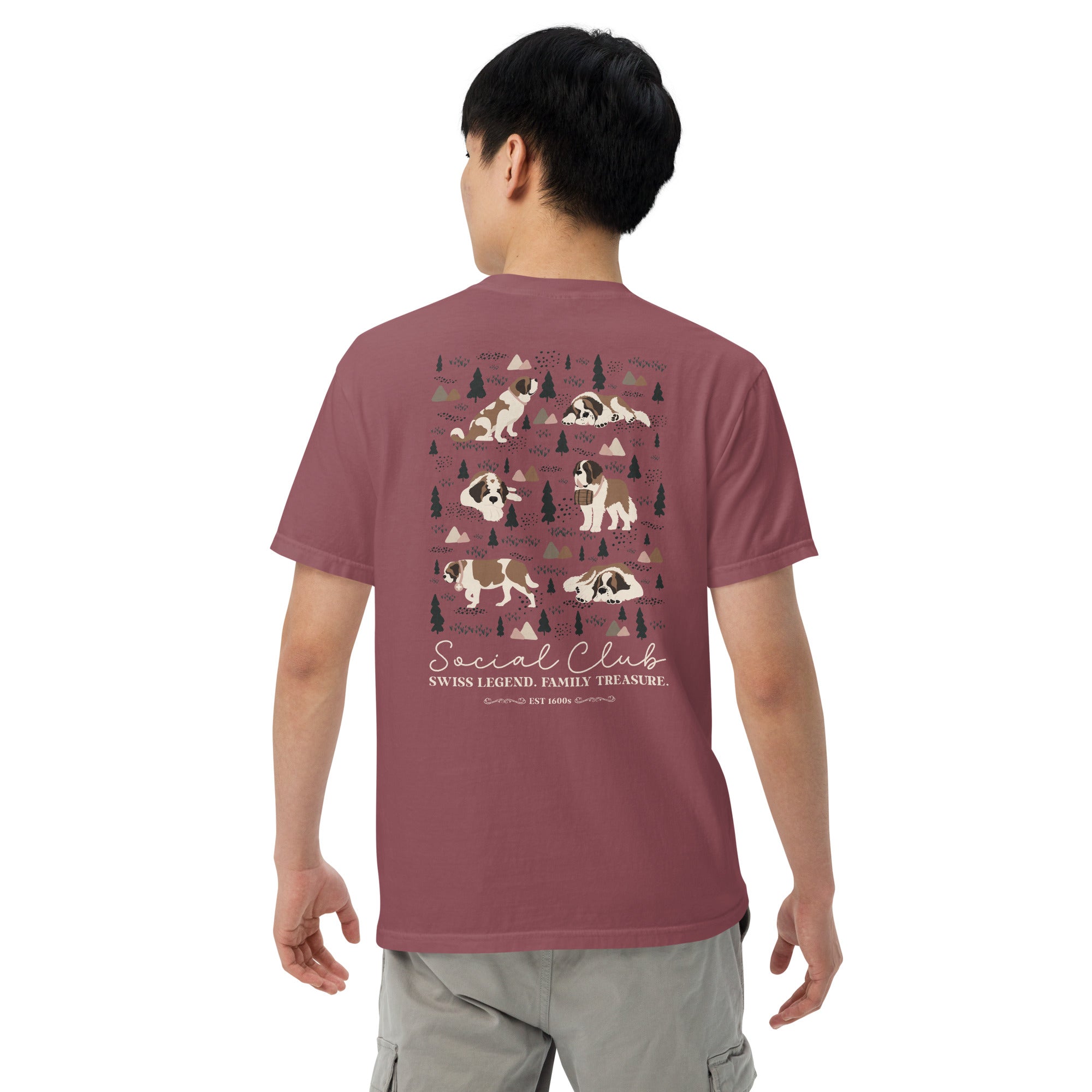 Comfort Colors brick t-shirt featuring a woodland-mountain theme with Saint Bernard dogs on the back with a badge on left chest. Perfect Saint Bernard gift for dog lovers.