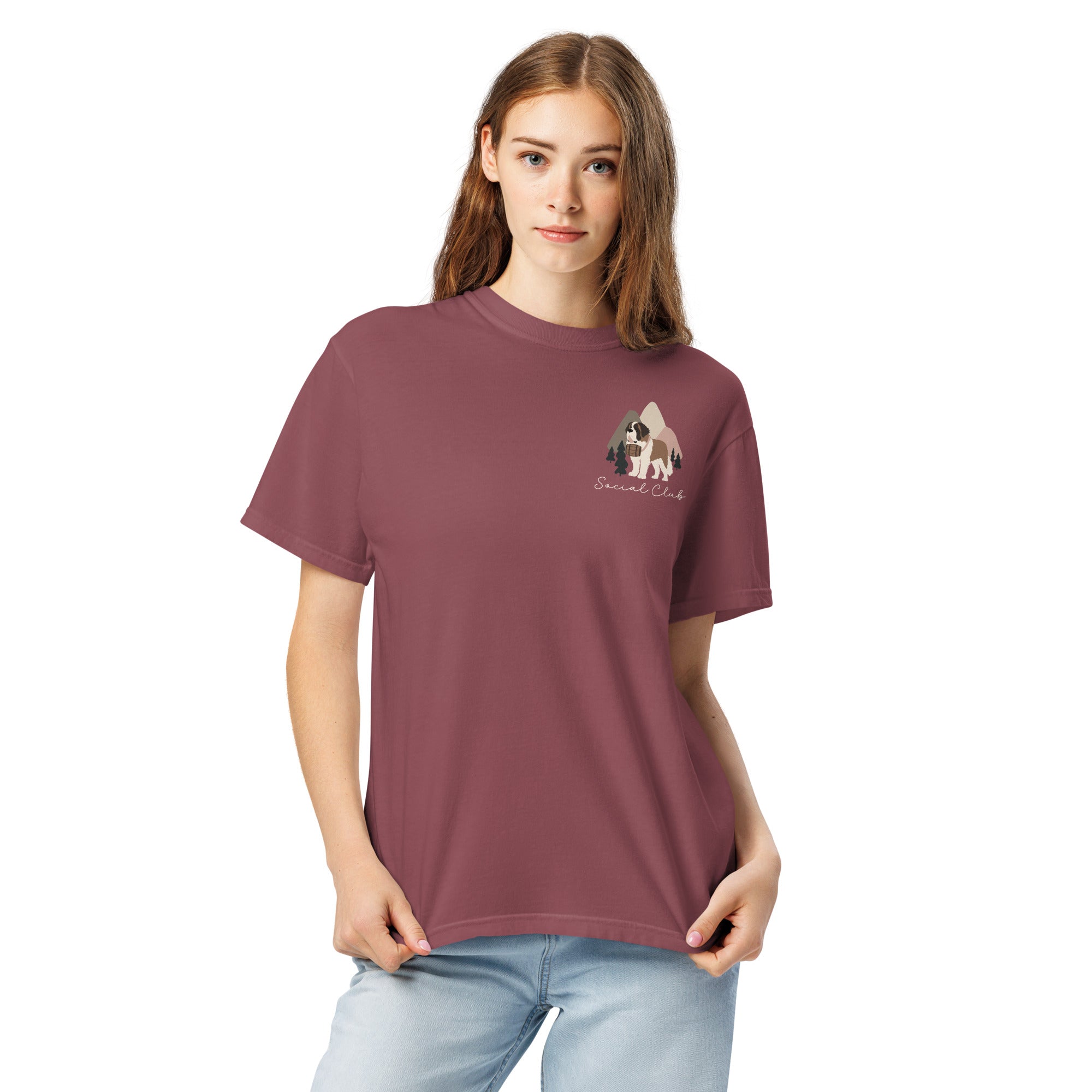Comfort Colors brick t-shirt featuring a woodland-mountain theme with Saint Bernard dogs on the back with a badge on left chest. Perfect Saint Bernard gift for dog lovers.