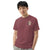 Comfort Colors brick t-shirt featuring a woodland-mountain theme with Saint Bernard dogs on the back with a badge on left chest. Perfect Saint Bernard gift for dog lovers.
