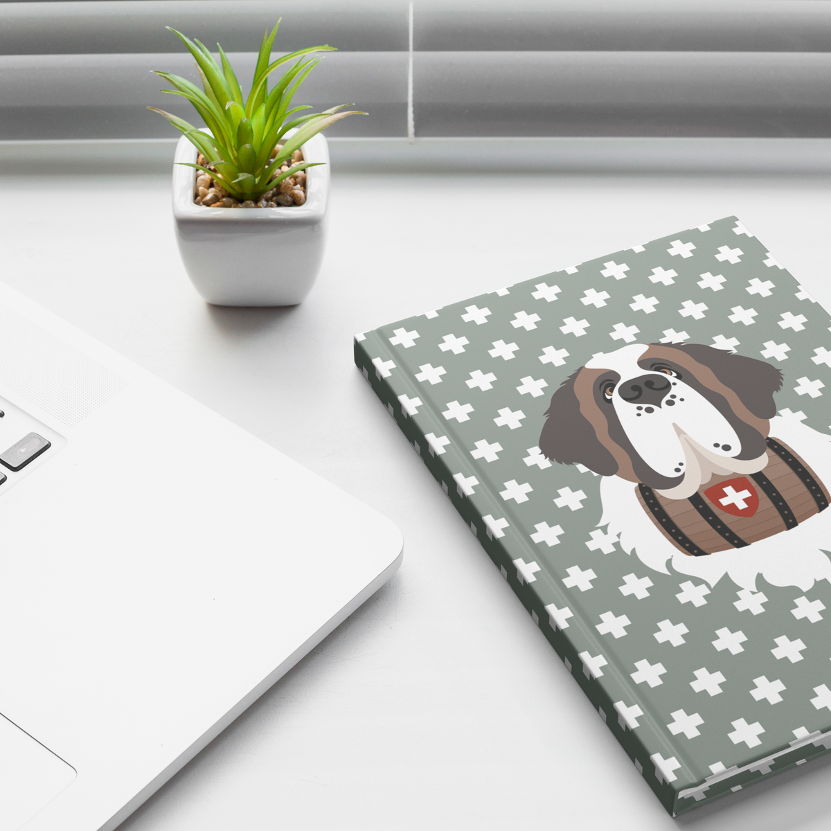Swiss Cross Green Saint Bernard hardcover lined journal with a soft green cover featuring a Saint Bernard and rescue barrel among white Swiss crosses.