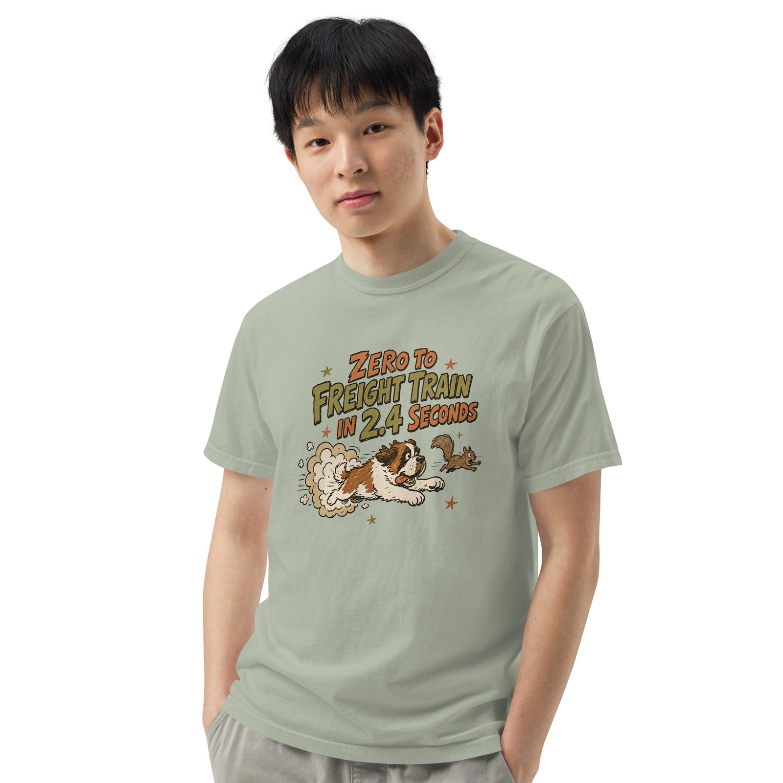 Bay green Comfort Colors t-shirt with a retro earth tone cartoon of a funny Saint Bernard chasing a squirrel and Zero to Freight Train in 2.4 Seconds lettering.