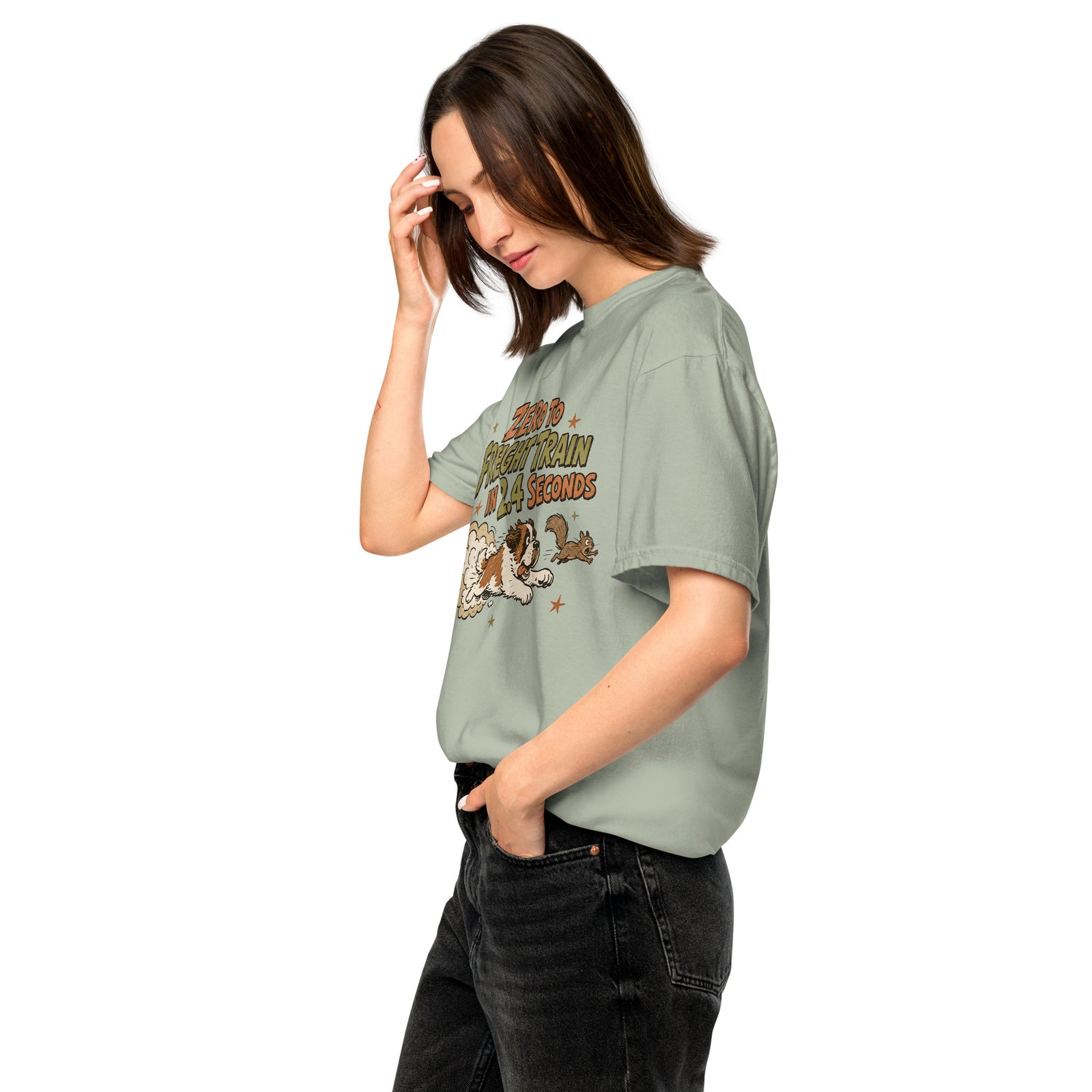 Bay green Comfort Colors t-shirt with a retro earth tone cartoon of a funny Saint Bernard chasing a squirrel and Zero to Freight Train in 2.4 Seconds lettering.