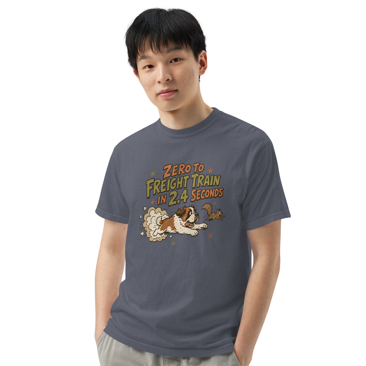 Denim blue Comfort Colors t-shirt with a retro earth tone cartoon of a funny Saint Bernard chasing a squirrel and Zero to Freight Train in 2.4 Seconds lettering.