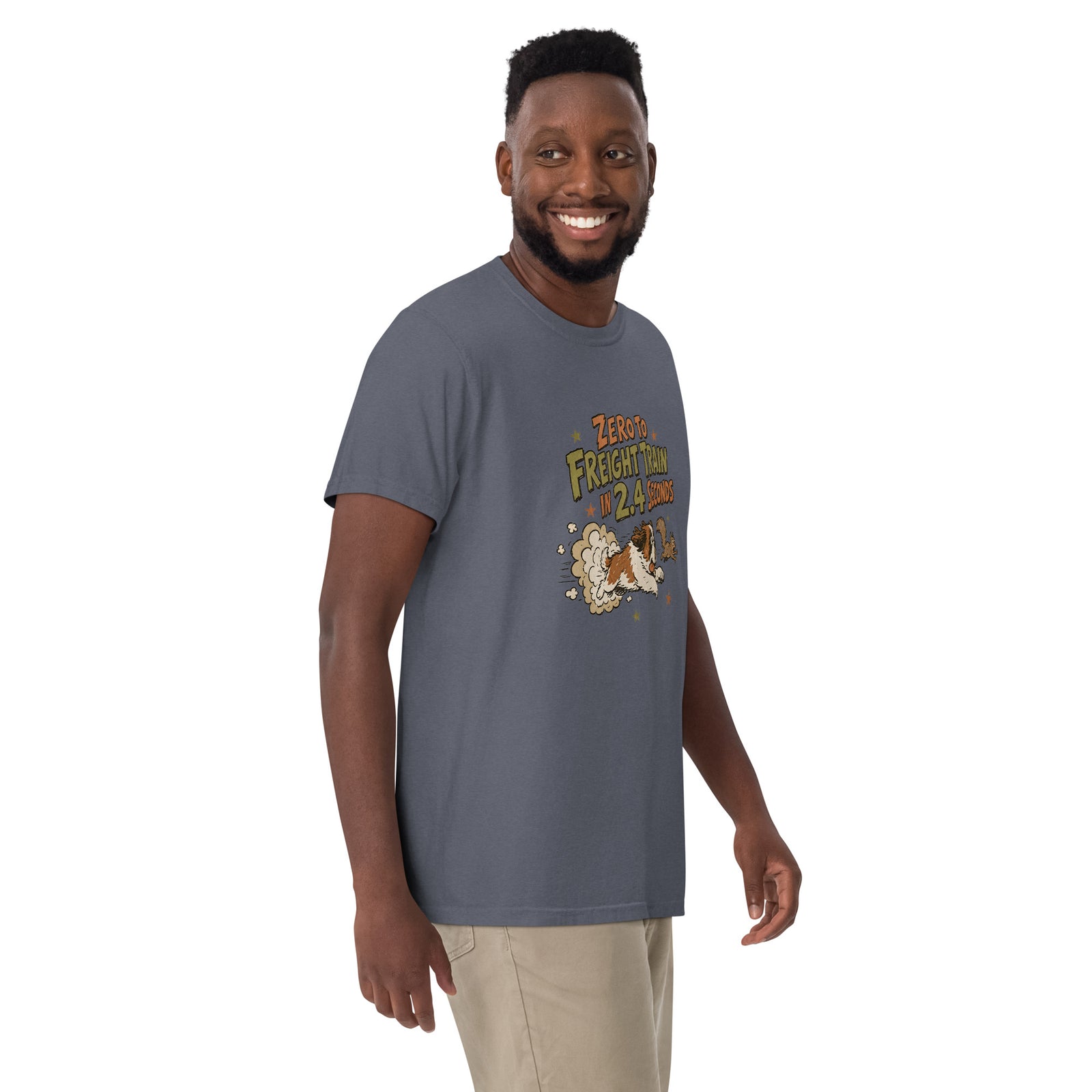 Denim blue Comfort Colors t-shirt with a retro earth tone cartoon of a funny Saint Bernard chasing a squirrel and Zero to Freight Train in 2.4 Seconds lettering.