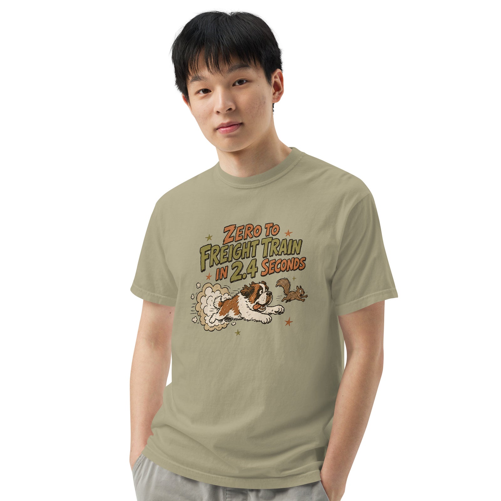 Khaki Comfort Colors t-shirt with a retro earth tone cartoon of a funny Saint Bernard chasing a squirrel and Zero to Freight Train in 2.4 Seconds lettering.
