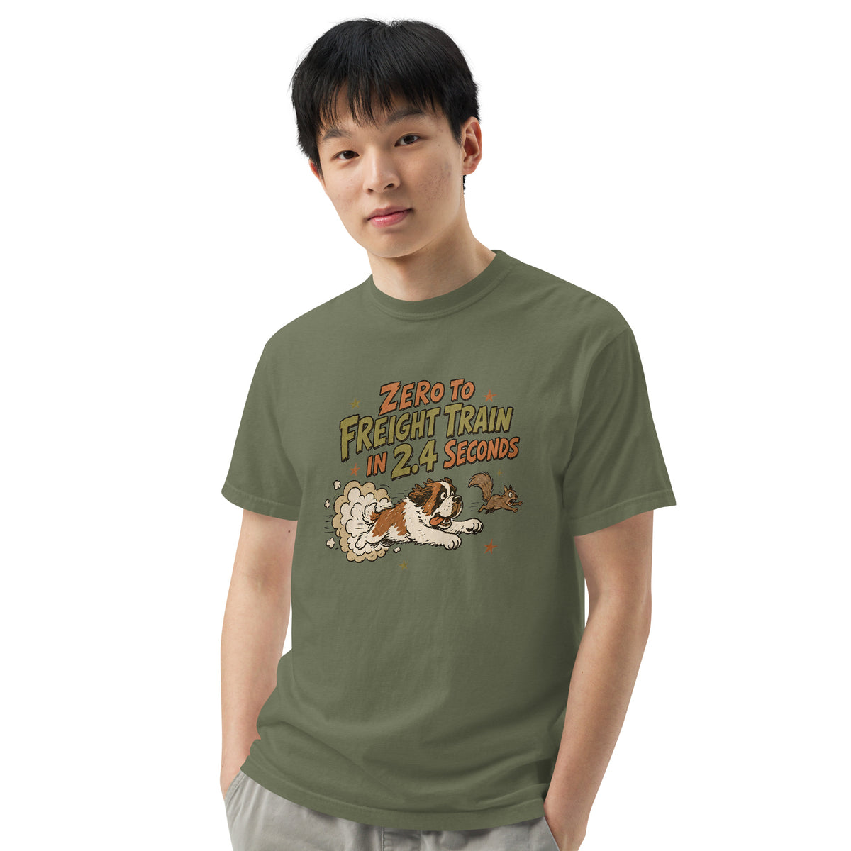 Moss green Comfort Colors t-shirt with a retro earth tone cartoon of a funny Saint Bernard chasing a squirrel and Zero to Freight Train in 2.4 Seconds lettering.