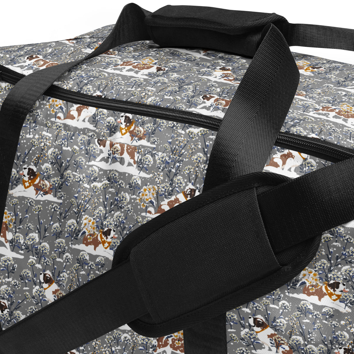 Snowflowers Saint Bernard floral duffle bag in soft gray, blue, white, and winter floral tones with padded black shoulder strap, handles, zip compartment, and mesh side pocket.