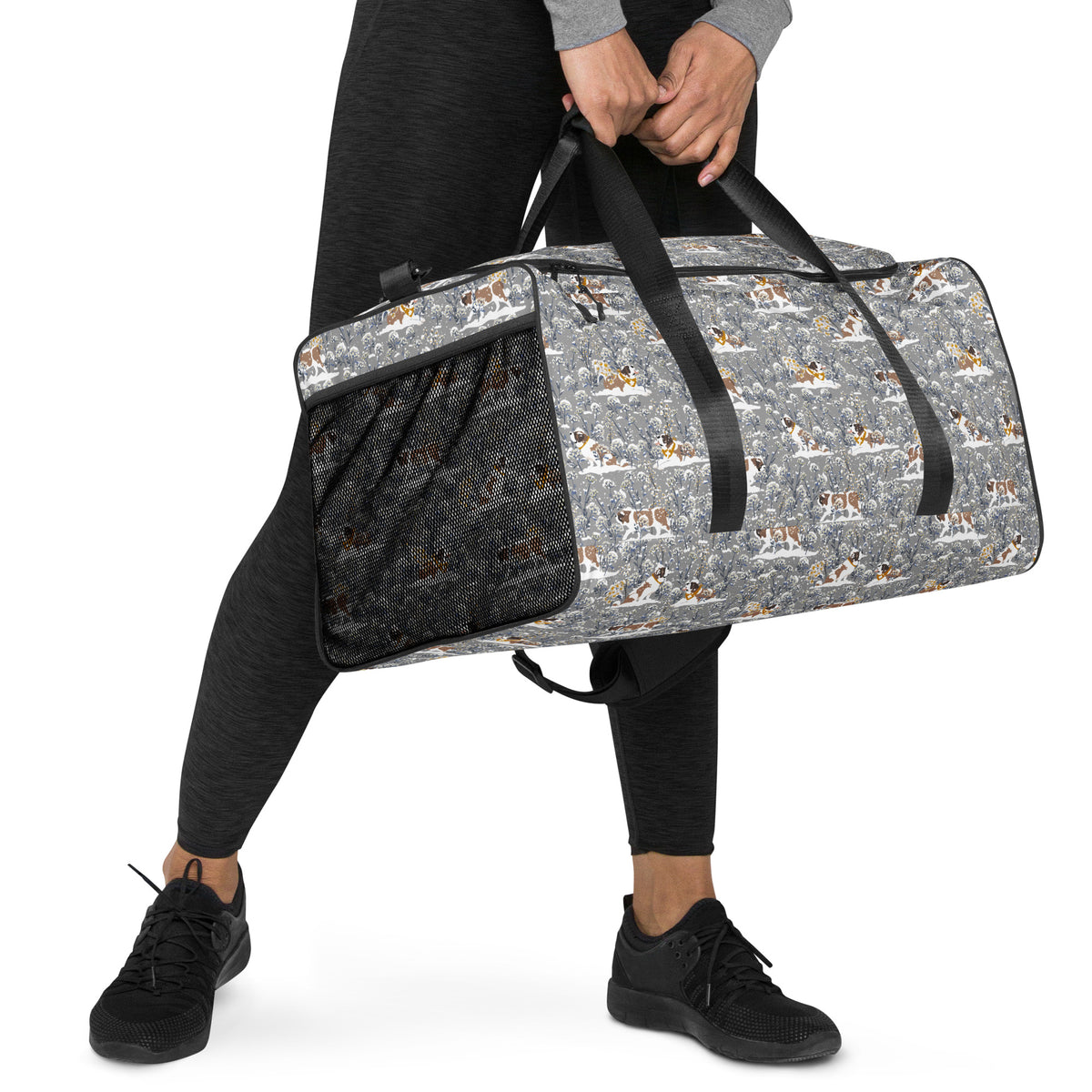 Snowflowers Saint Bernard floral duffle bag in soft gray, blue, white, and winter floral tones with padded black shoulder strap, handles, zip compartment, and mesh side pocket.