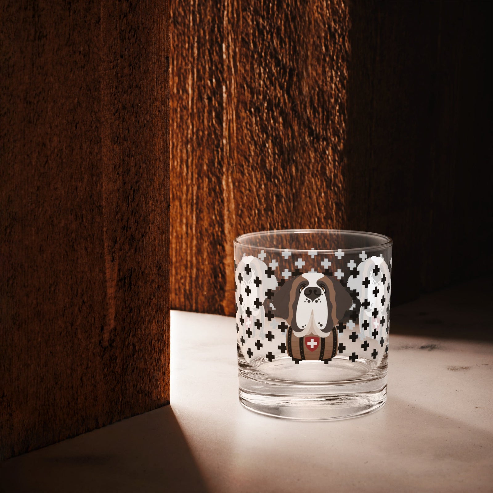 10.5 once rock glass drinkware with a modern pattern of Swiss inspired black crosses and a cute large Saint Bernard dog head with a barrel by Lucy and Norman
