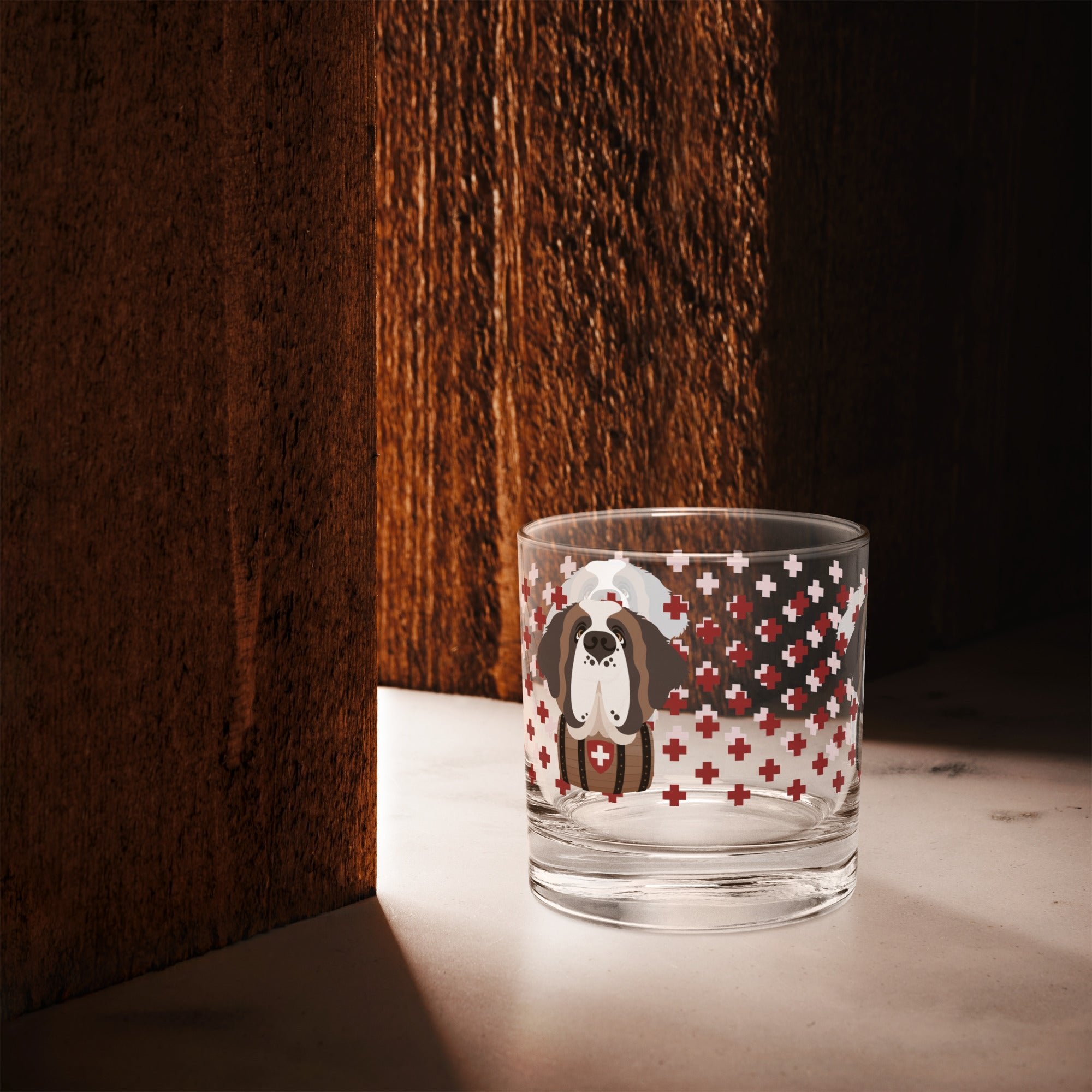 10.5 once rock glass drinkware with a modern pattern of Swiss inspired red crosses and a cute large Saint Bernard dog head with a barrel by Lucy and Norman