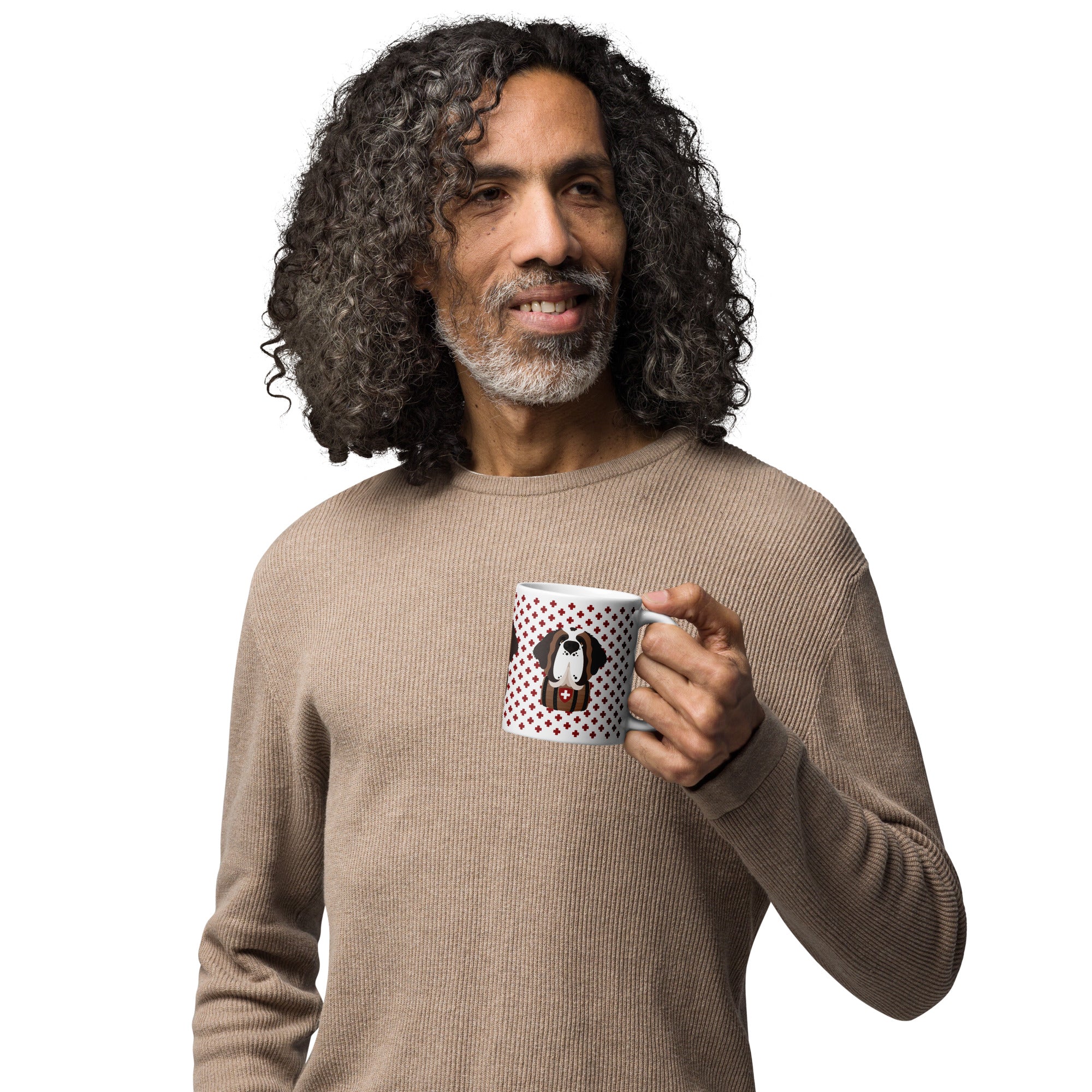 White ceramic 11 ounce mug featuring a cute illustrated Saint Bernard dog wearing a rescue barrel, surrounded by a red Swiss cross pattern. Perfect gift for St Bernard dog lovers and Swiss Alps fans by Lucy and Norman.