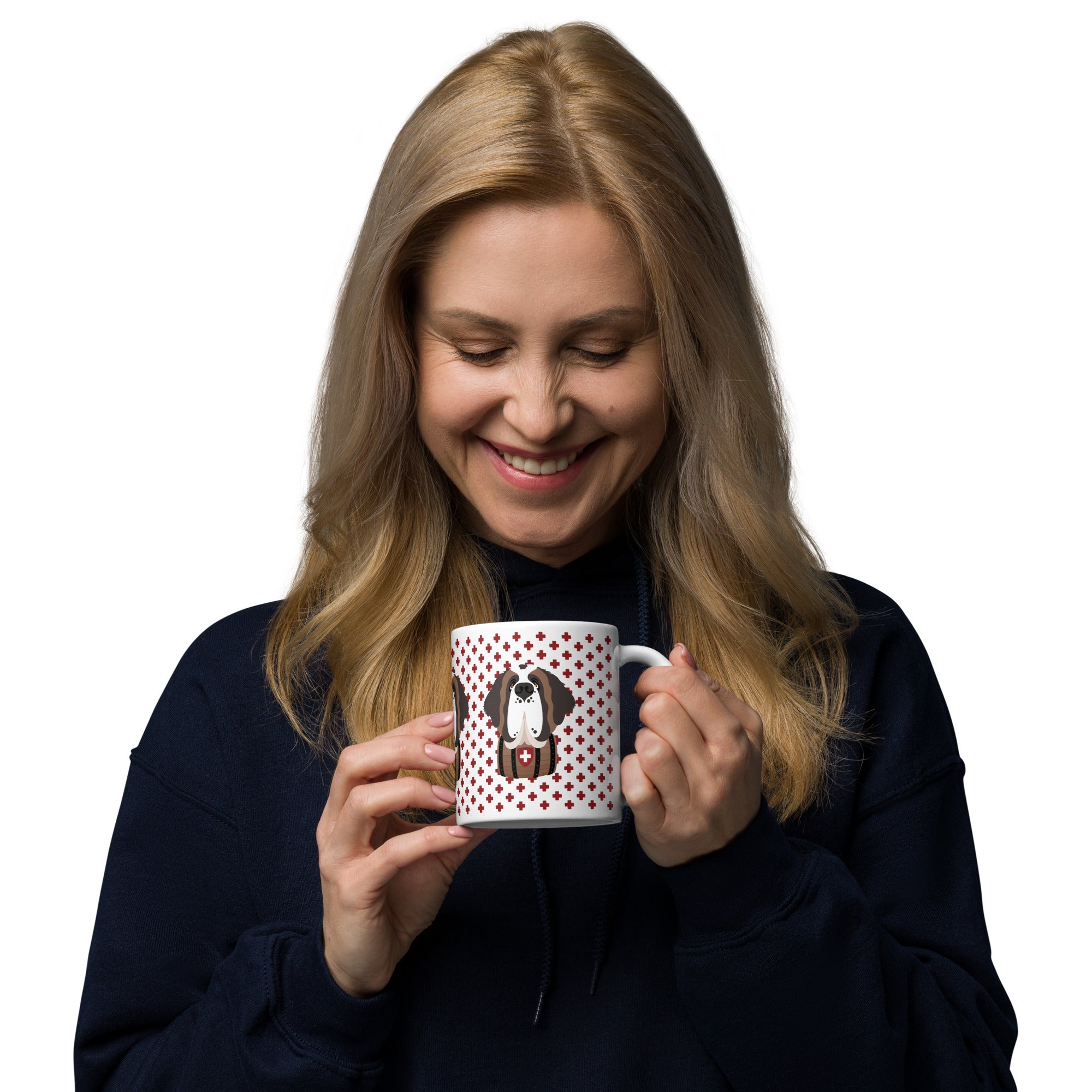 White ceramic 11 ounce mug featuring a cute illustrated Saint Bernard dog wearing a rescue barrel, surrounded by a red Swiss cross pattern. Perfect gift for St Bernard dog lovers and Swiss Alps fans by Lucy and Norman.