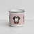 White enamel 12 ounce camp mug with silver rim featuring a cute illustrated Saint Bernard dog wearing a rescue barrel, surrounded by a red Swiss cross pattern. Perfect gift for St Bernard dog lovers and Swiss Alps fans by Lucy and Norman.