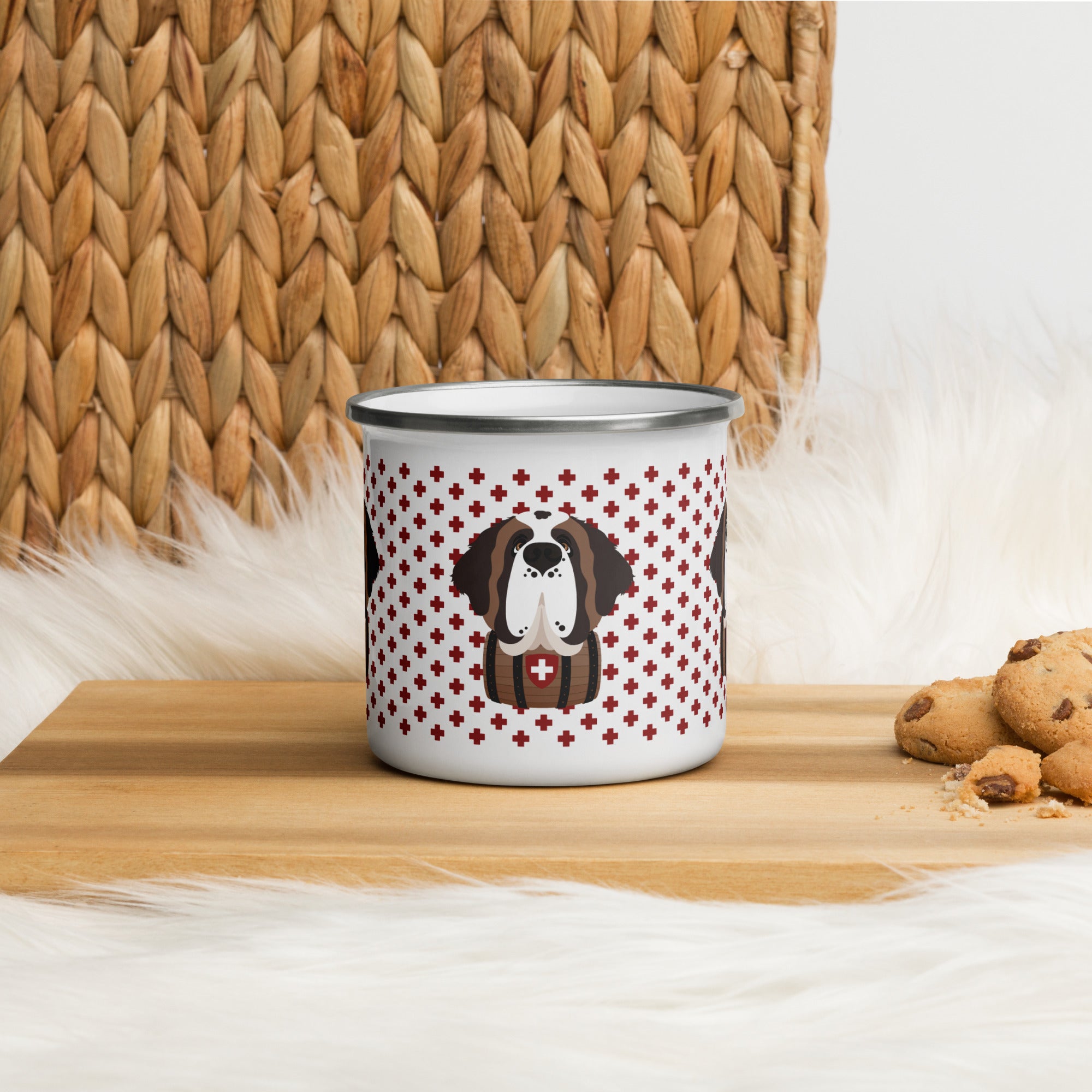 White enamel 12 ounce camp mug with silver rim featuring a cute illustrated Saint Bernard dog wearing a rescue barrel, surrounded by a red Swiss cross pattern. Perfect gift for St Bernard dog lovers and Swiss Alps fans by Lucy and Norman.