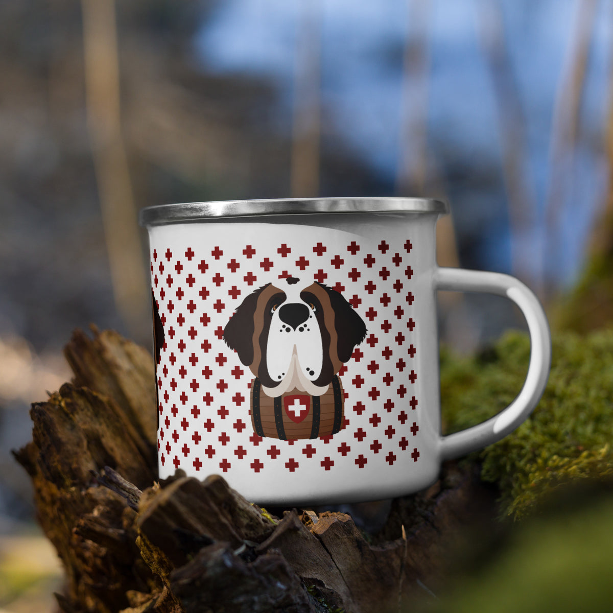 White enamel 12 ounce camp mug with silver rim featuring a cute illustrated Saint Bernard dog wearing a rescue barrel, surrounded by a red Swiss cross pattern. Perfect gift for St Bernard dog lovers and Swiss Alps fans by Lucy and Norman.