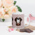 White ceramic 15 ounce mug featuring a cute illustrated Saint Bernard dog wearing a rescue barrel, surrounded by a red Swiss cross pattern. Perfect gift for St Bernard dog lovers and Swiss Alps fans by Lucy and Norman.