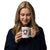 White ceramic 15 ounce mug featuring a cute illustrated Saint Bernard dog wearing a rescue barrel, surrounded by a red Swiss cross pattern. Perfect gift for St Bernard dog lovers and Swiss Alps fans by Lucy and Norman.