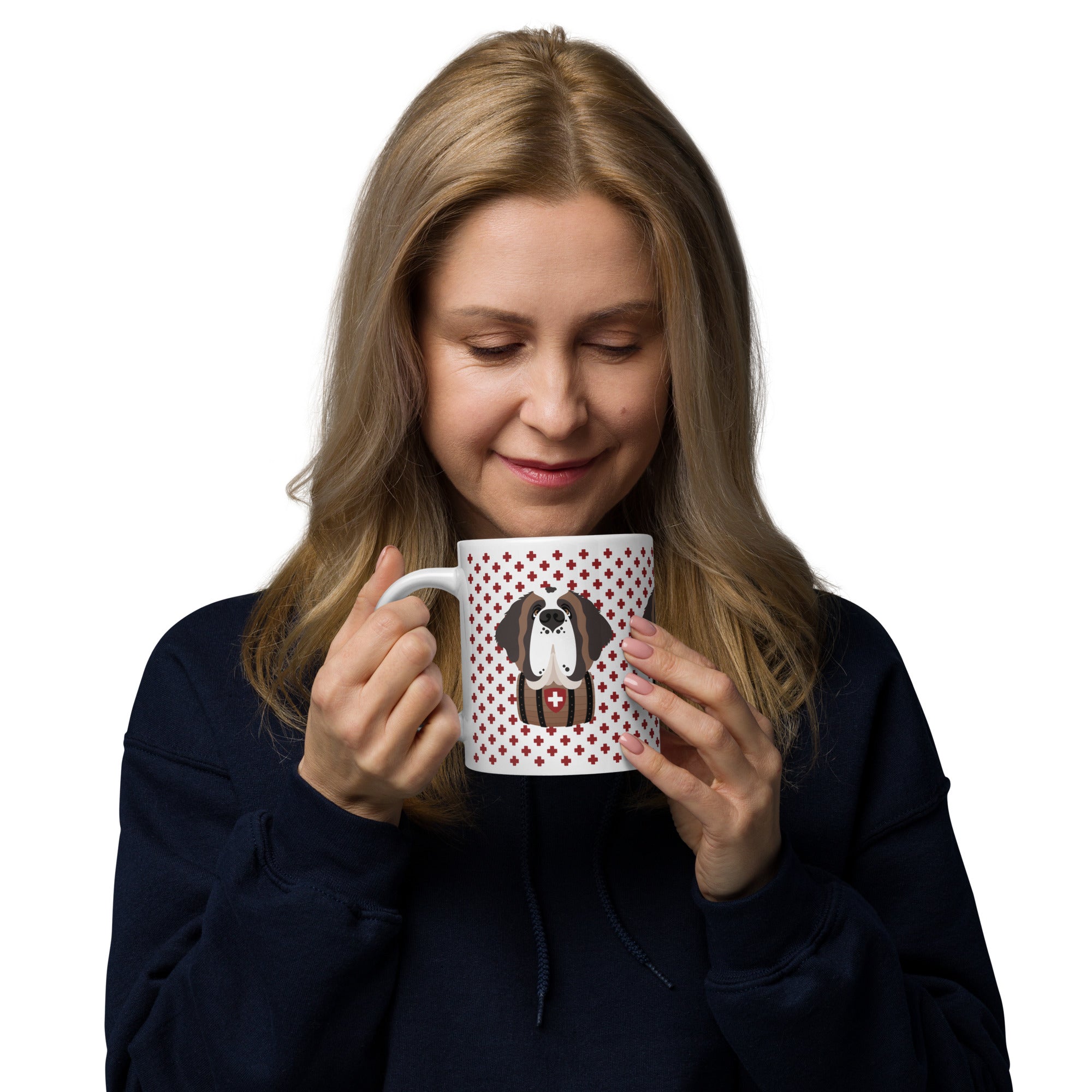 White ceramic 20 ounce mug featuring a cute illustrated Saint Bernard dog wearing a rescue barrel, surrounded by a red Swiss cross pattern. Perfect gift for St Bernard dog lovers and Swiss Alps fans by Lucy and Norman.